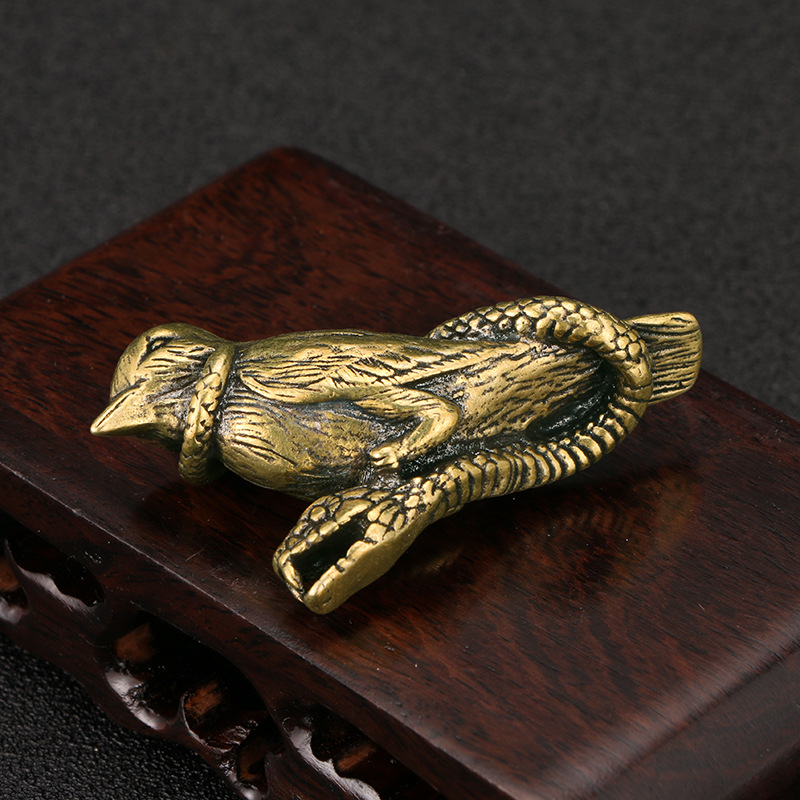 Title 5, Fierce Snake Wrapped Bird Brass Ornaments