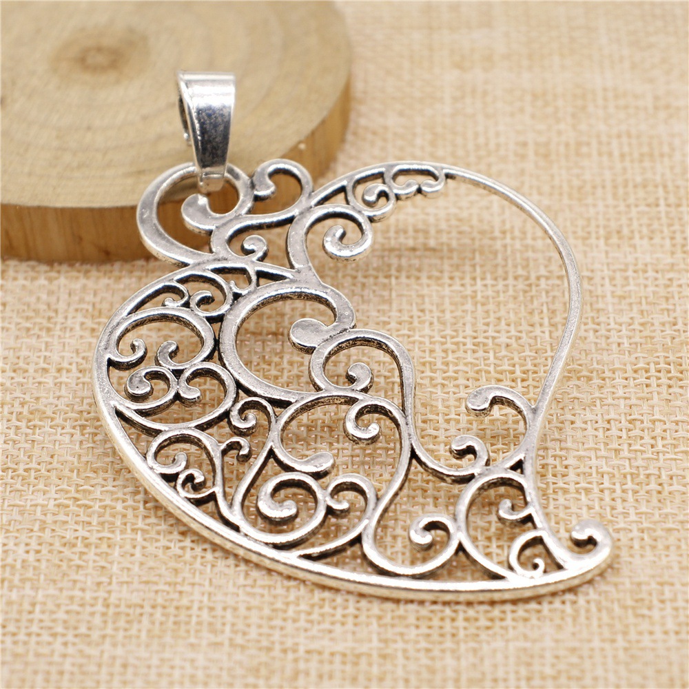Geometric Carved Peach Heart Pendant