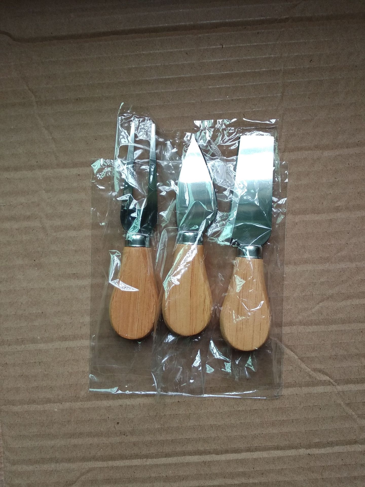 Title 2, Stainless steel cheese knife with oak handle