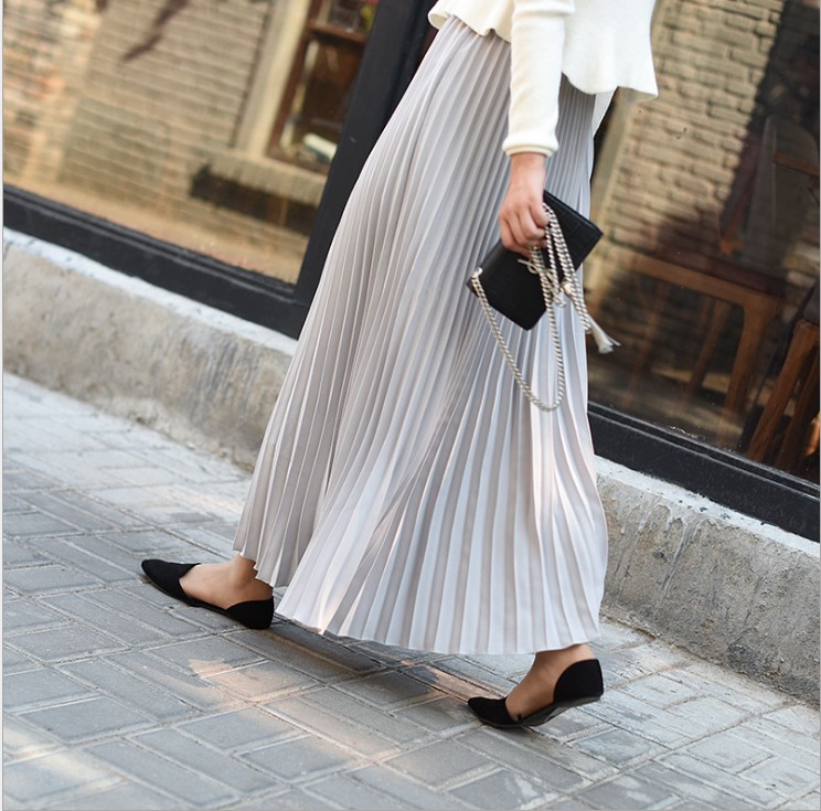 Title 2, Solid color pleated skirt offers effortless sty...