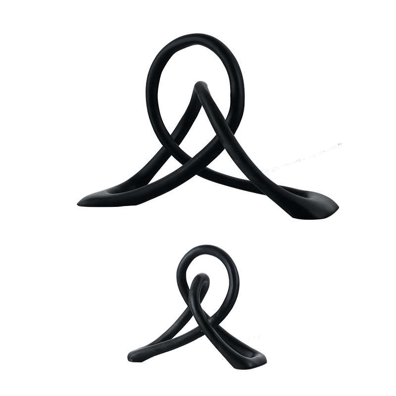 Title 2, Simple and modern black resin twisted knot abst...