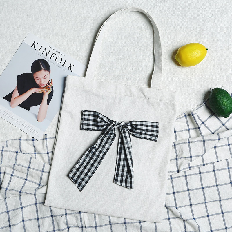 New fashion trend literature and art women's bag butterfly knot female hand canvas bag manufacturer direct selling