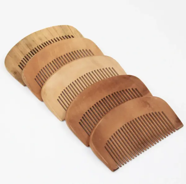 Peach wood comb advertising small wooden hair