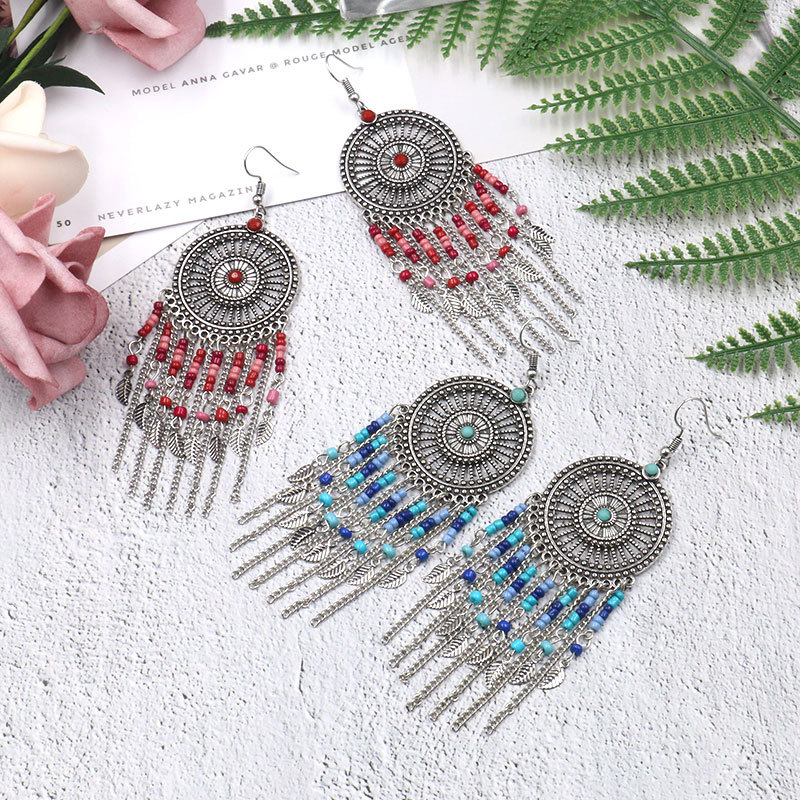 Beaded fringed hollow earrings