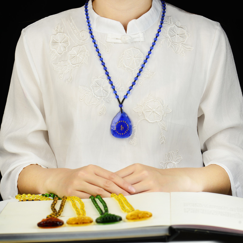 Glass pendant Buddha statue