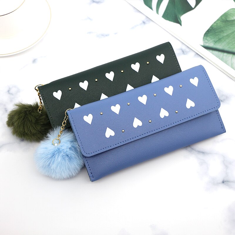 Ladies heart-shaped fur ball clutch