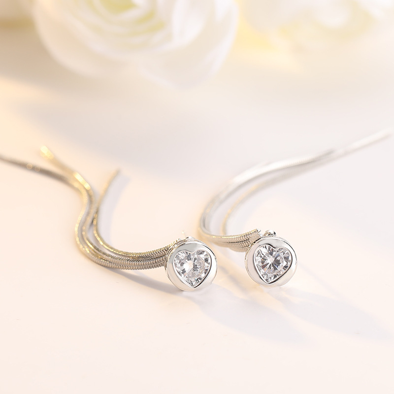 Single diamond tassel earring