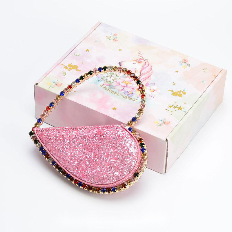 Diamond studded dinner bag with diamond heart-shaped clutch