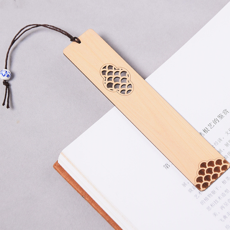 Traditional dragon and phoenix pattern detail on wooden bookmark