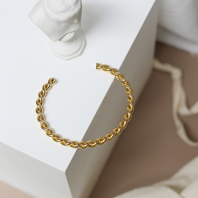 Twisted Ties Smoothly Wrapped Around A Thread Bracelet