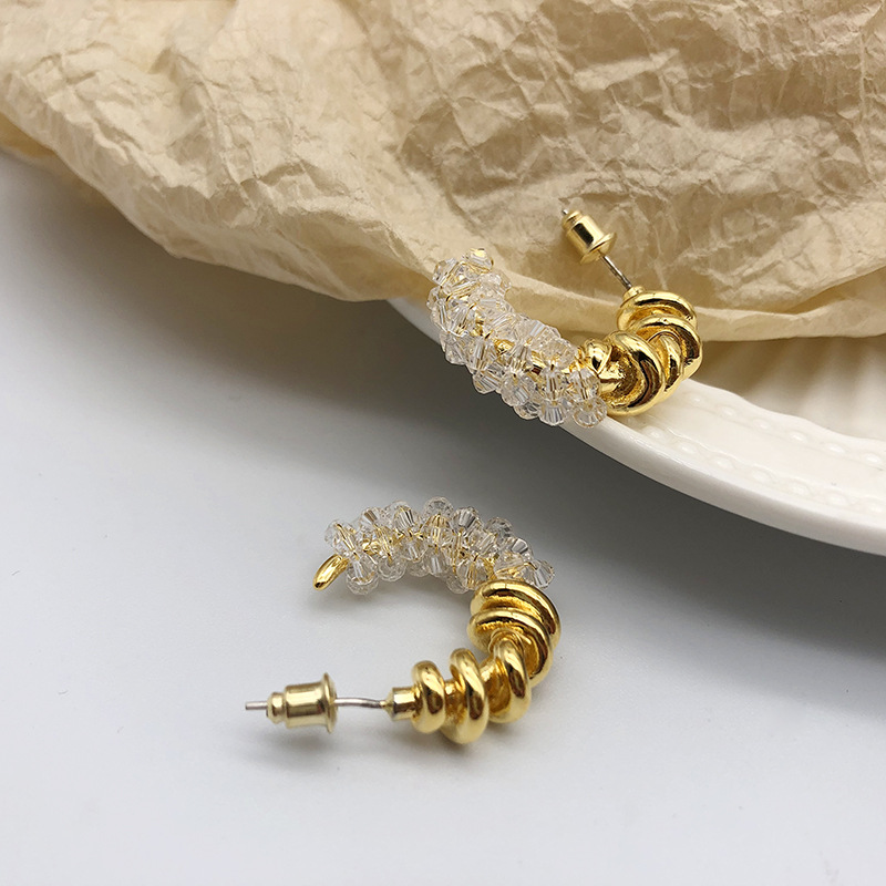 European and American pearl earrings female C-shaped winding stitching crystal metal earrings simple personality earrings earrings