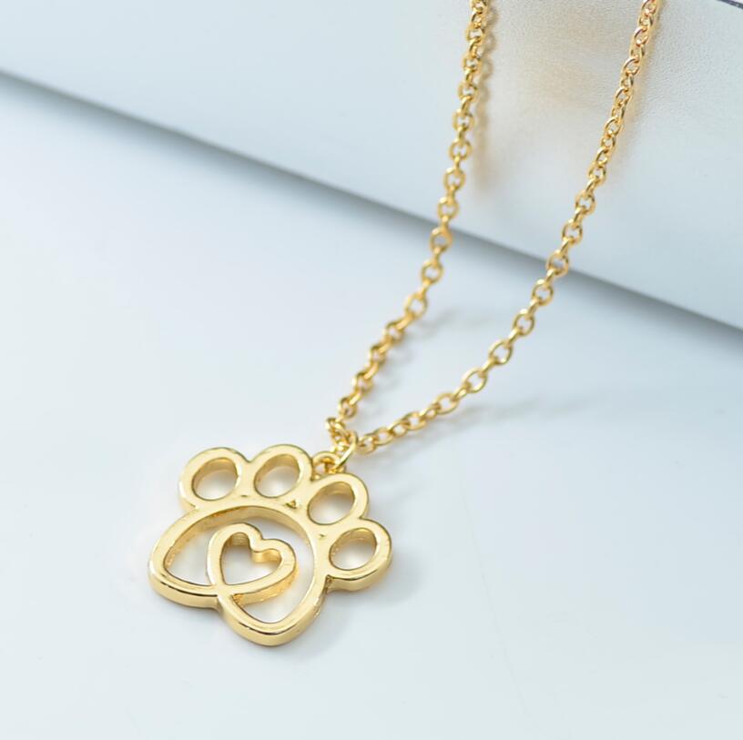 K900 Foreign Trade Hot Selling New Pet Footprint Pendant Hollow Love Dog Paw Necklace Jewelry Manufacturer Wholesale