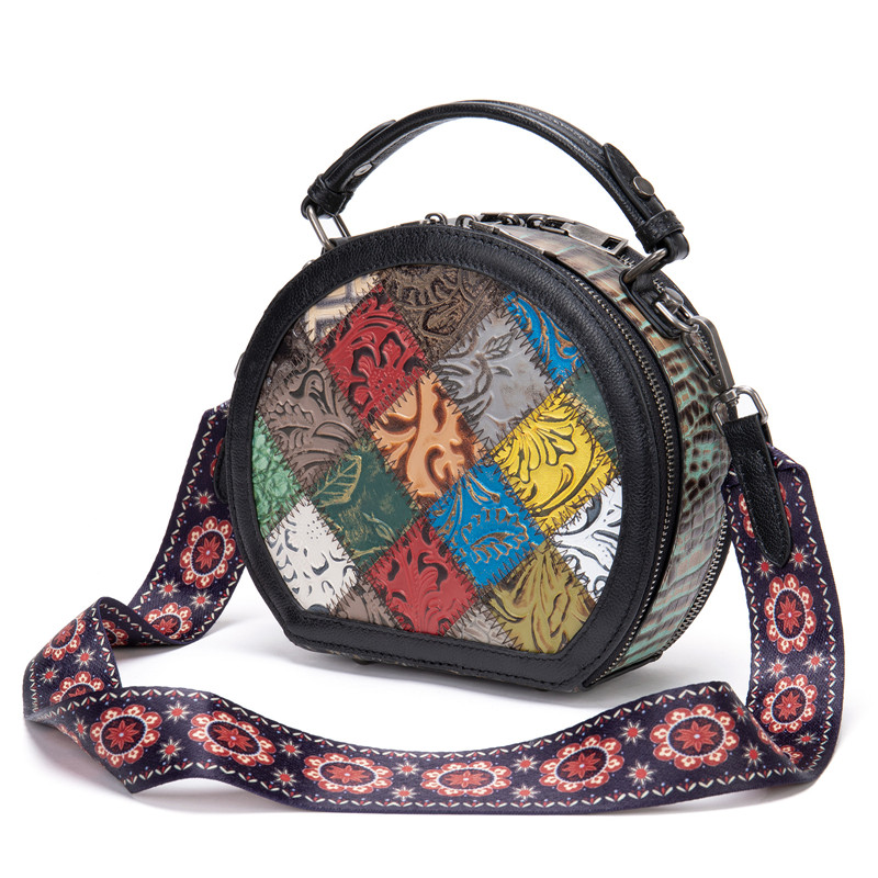 "Vintage Patchwork Leather Mini Handbag with a colorful geometric pattern and a detailed wide floral-patterned shoulder strap, showcasing the bag's unique and vibrant design."