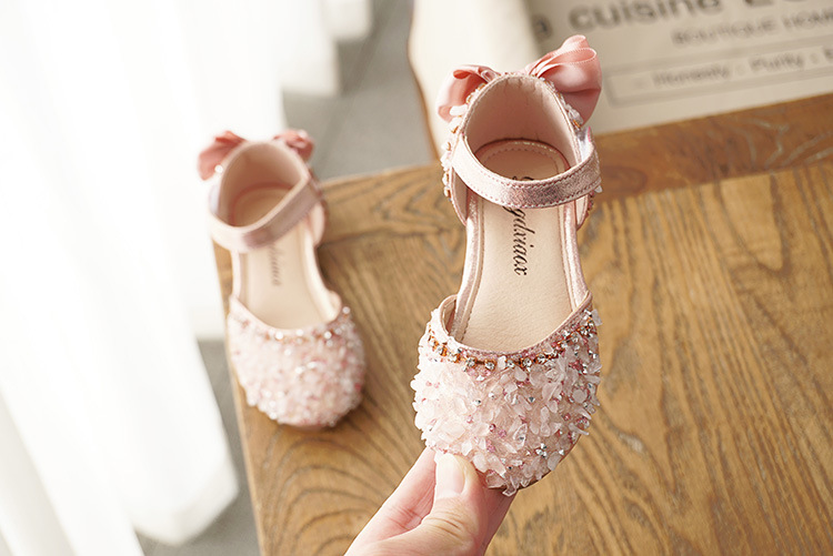 Title 5, Girls sandals with rhinestone accents and a so...