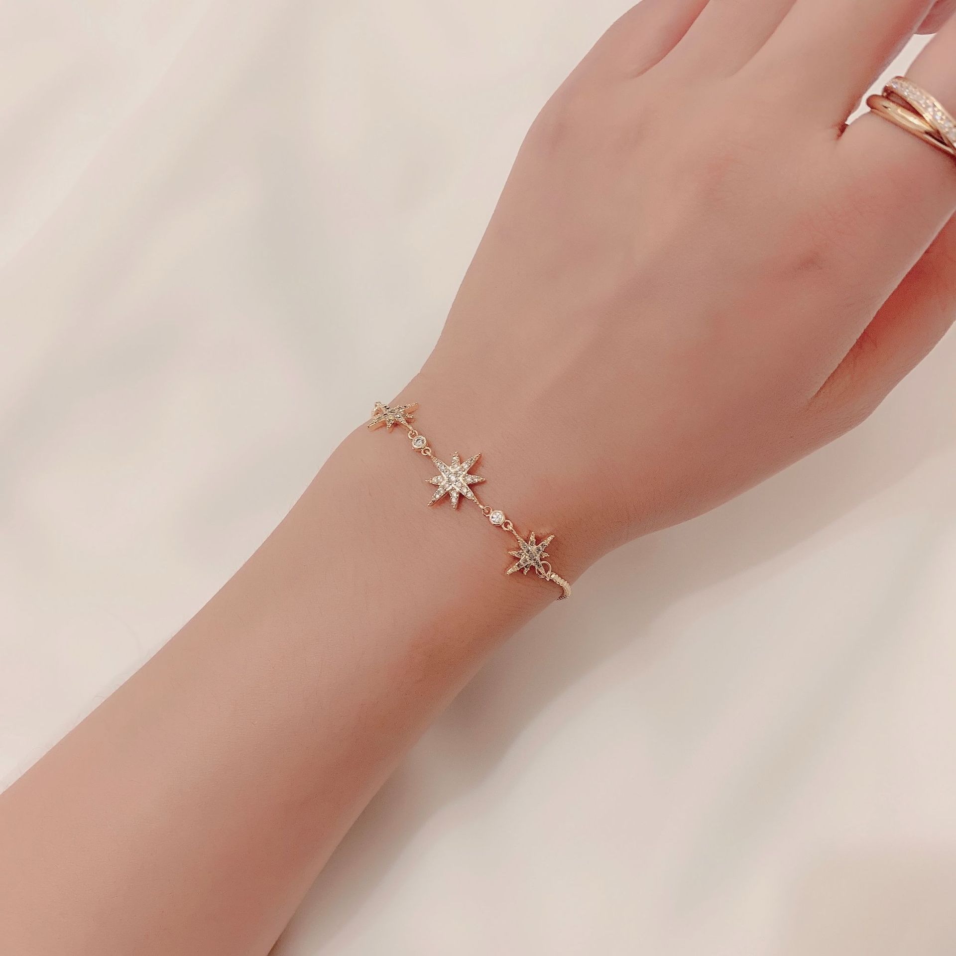 Title 13, Six-pointed star bracelet