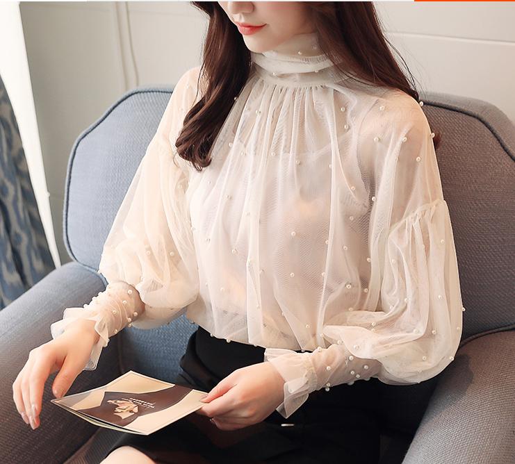 Title 2, Womens Lantern Sleeve Mesh Chiffon Shirt. A st...