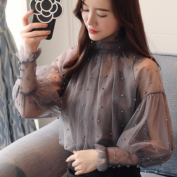 Title 6, Womens Lantern Sleeve Mesh Chiffon Shirt. A st...