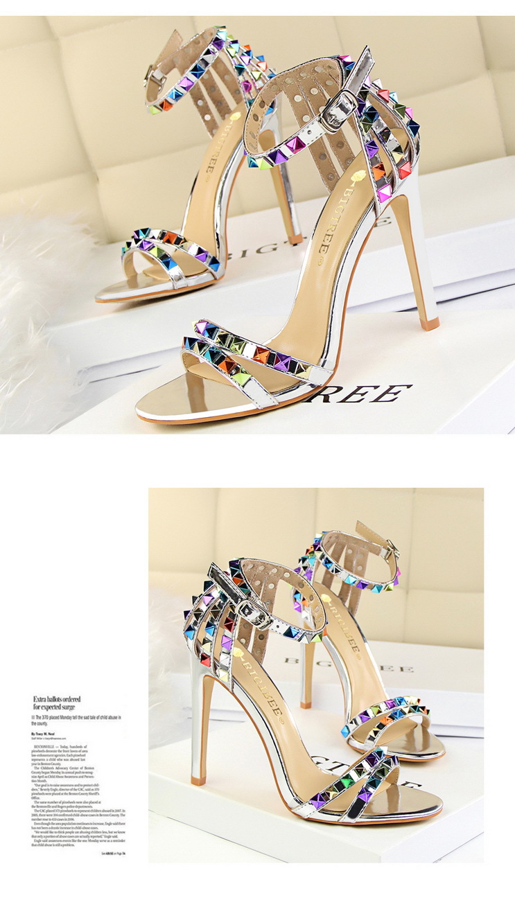 Title 2, Open-toe sandals with cutout colorful studs. St...