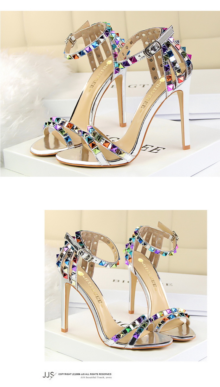 Title 3, Open-toe sandals with cutout colorful studs. St...