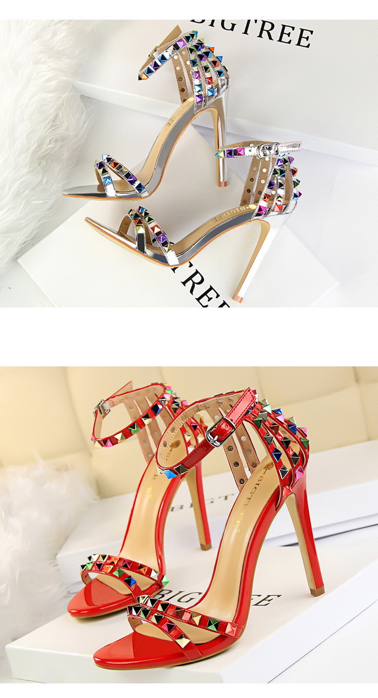 Title 4, Open-toe sandals with cutout colorful studs. St...