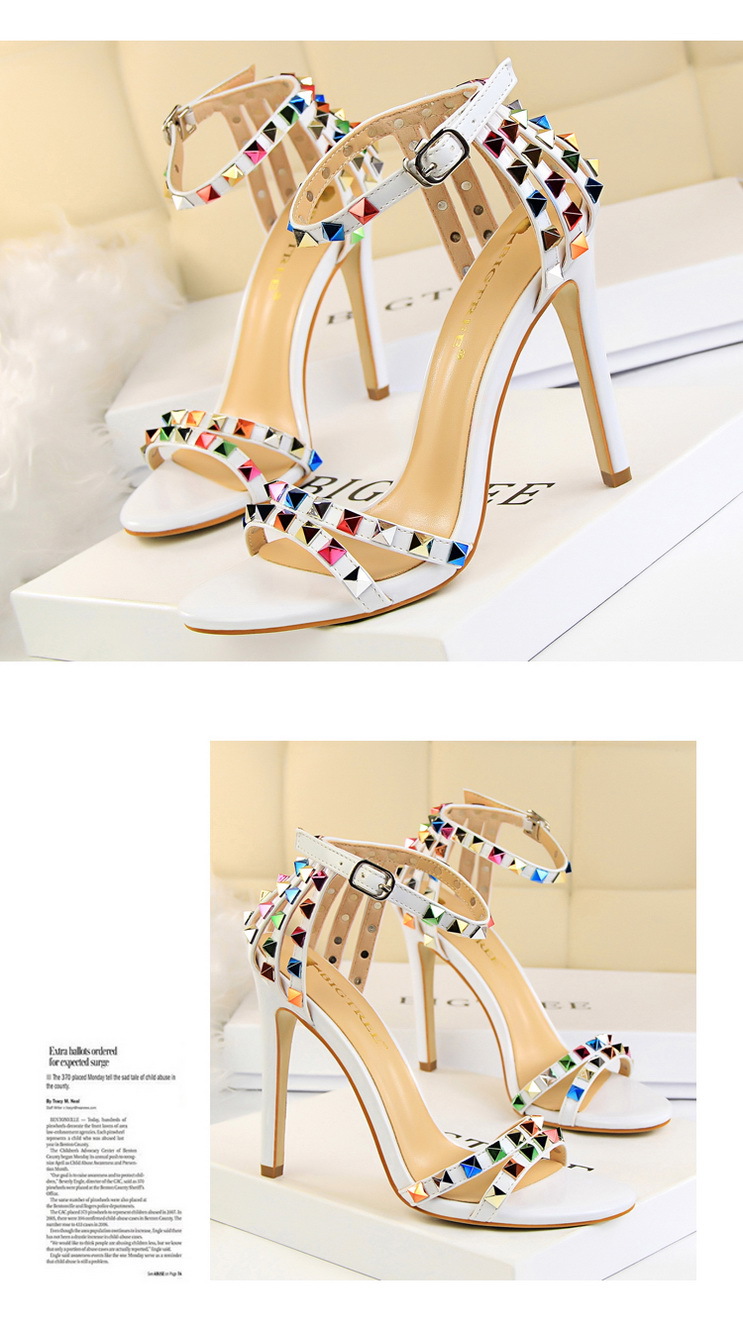 Title 7, Open-toe sandals with cutout colorful studs. St...