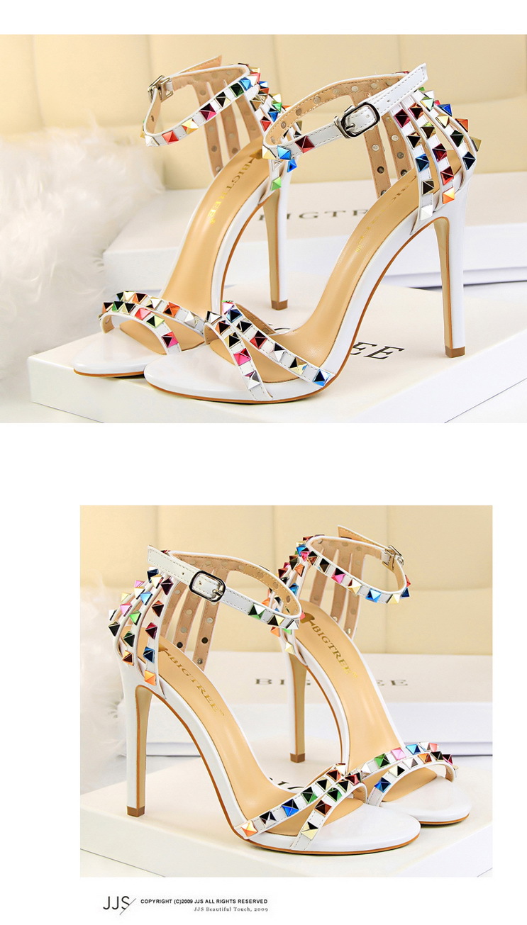 Title 8, Open-toe sandals with cutout colorful studs. St...