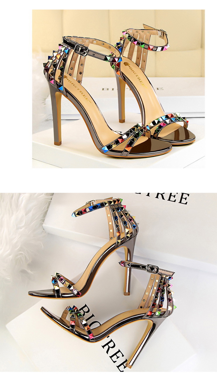 Title 16, Open-toe sandals with cutout colorful studs. St...