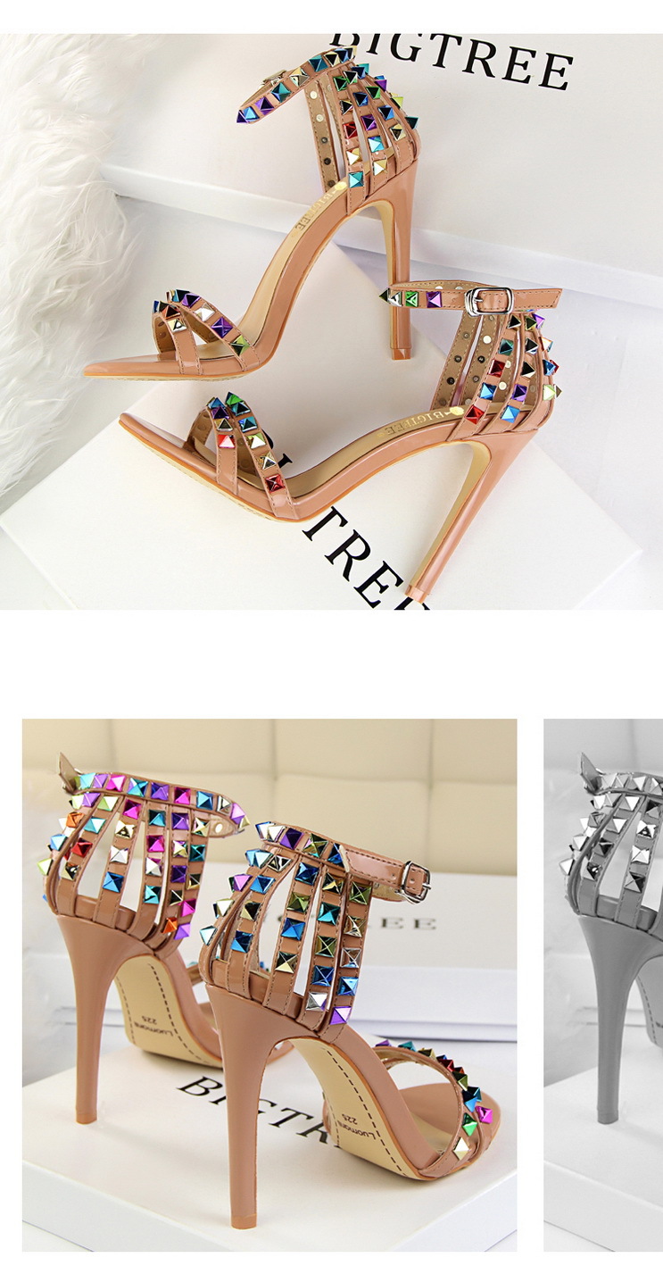 Title 19, Open-toe sandals with cutout colorful studs. St...