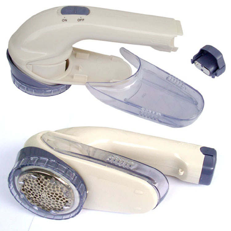 Title 8, Battery-powered clothes shaver. Removes lint, f...