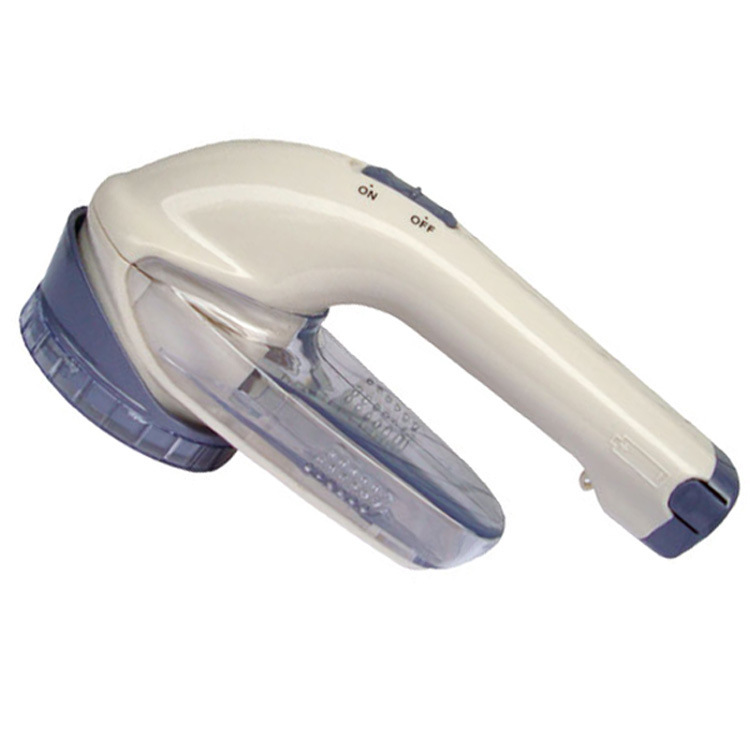 Title 9, Battery-powered clothes shaver. Removes lint, f...