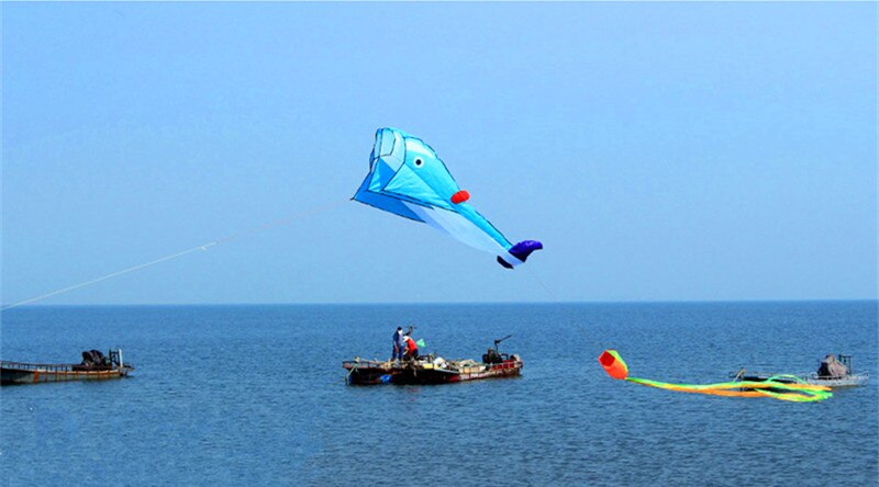 Blue Dolphin Kite in the Sky and 3 boats in the water