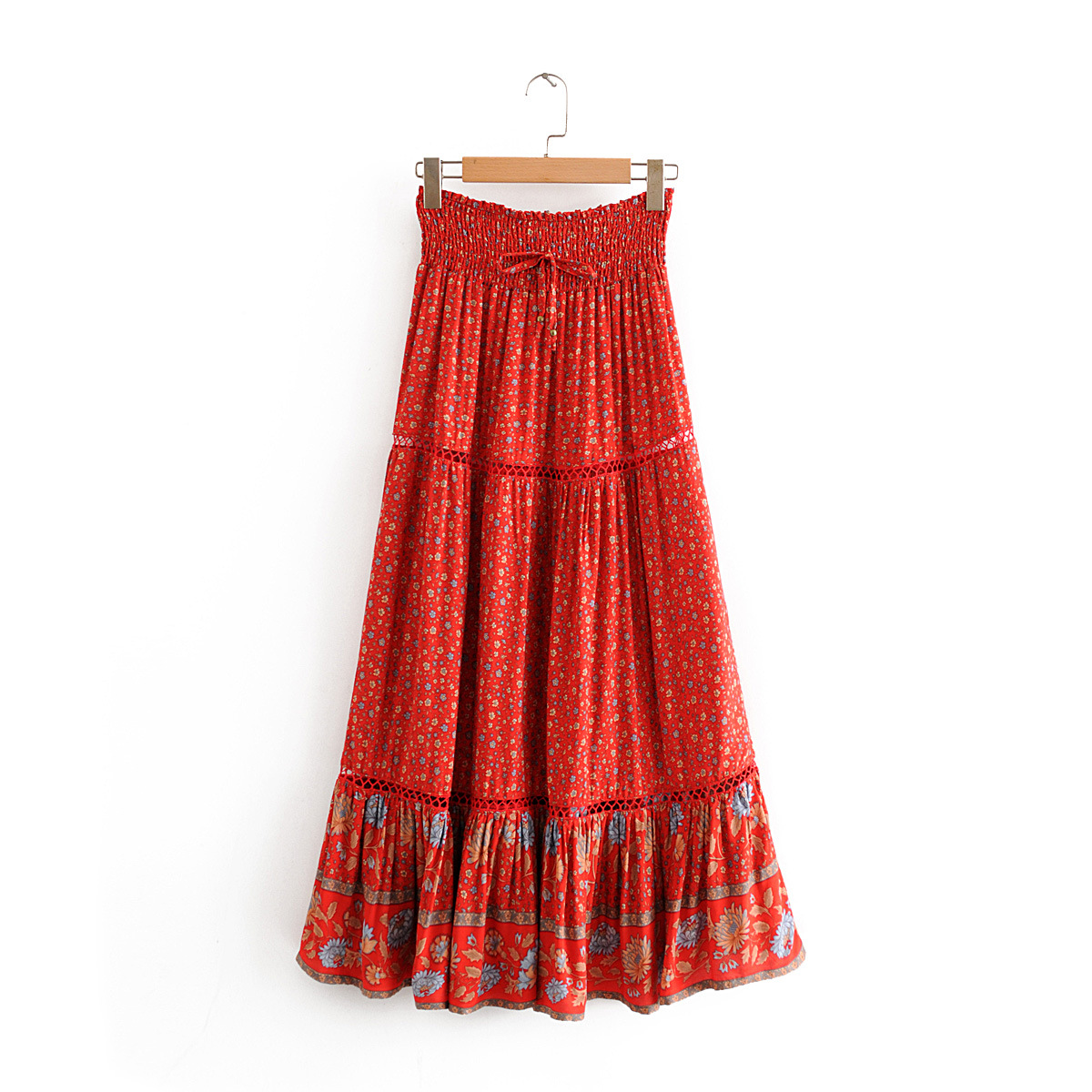 Title 2, Printed red sunflower cutout skirt, a vibrant a...