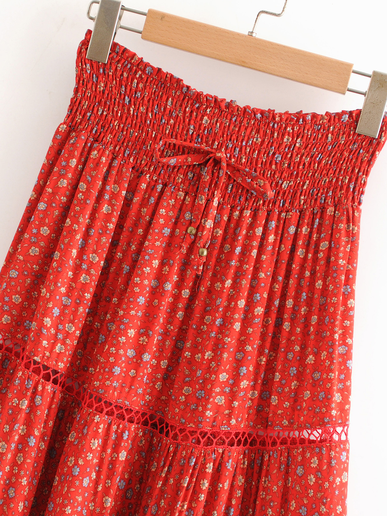 Title 4, Printed red sunflower cutout skirt, a vibrant a...