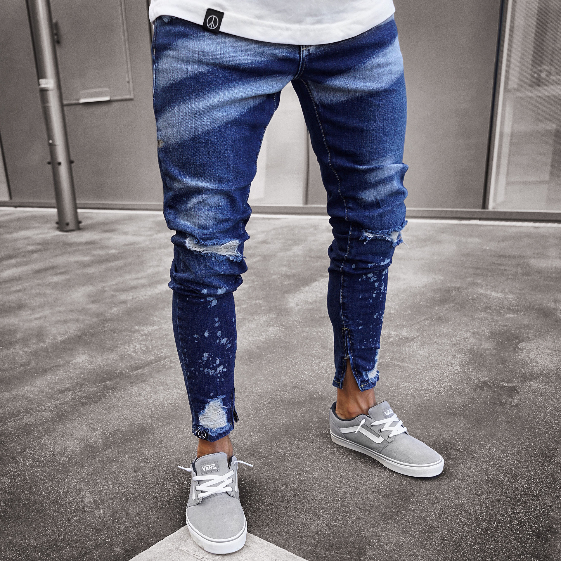 Title 4, Jeans uomo strappati con vernice e zip. Pantalo...