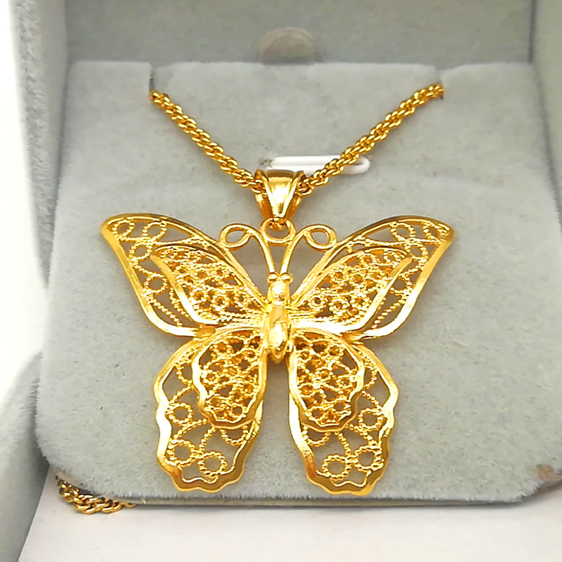 Title 1, Gold-plated brass butterfly pendant