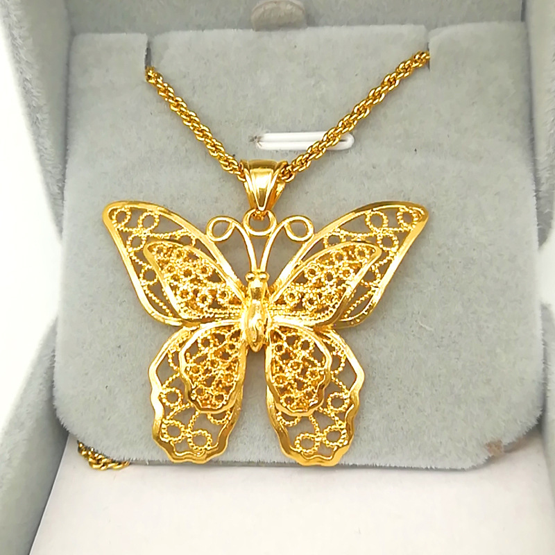 Title 2, Gold-plated brass butterfly pendant