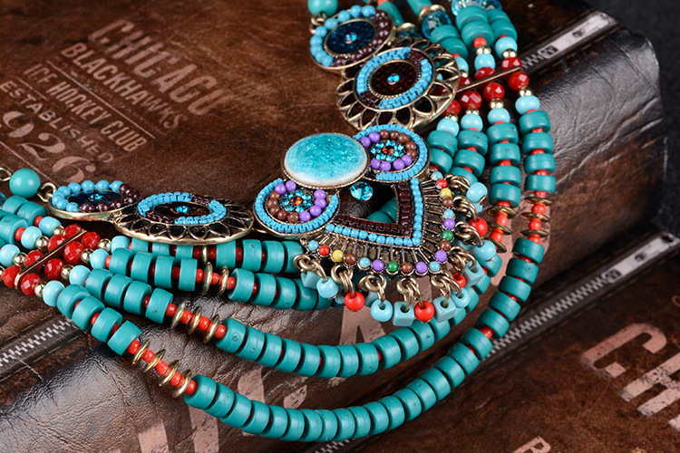 Title 8, Exaggerated ethnic necklace