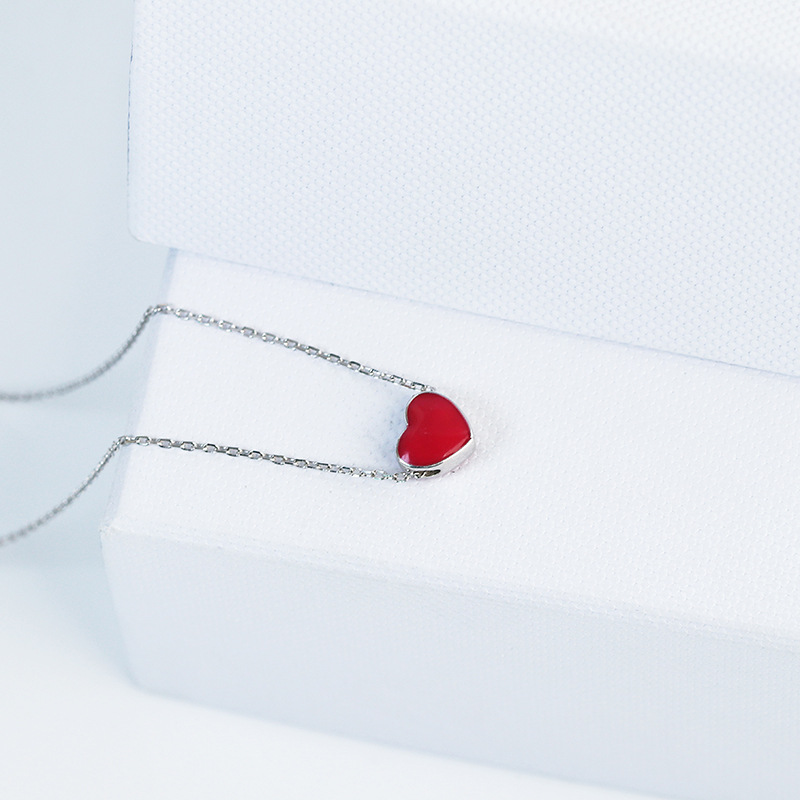 Title 5, Discolored small red heart necklace