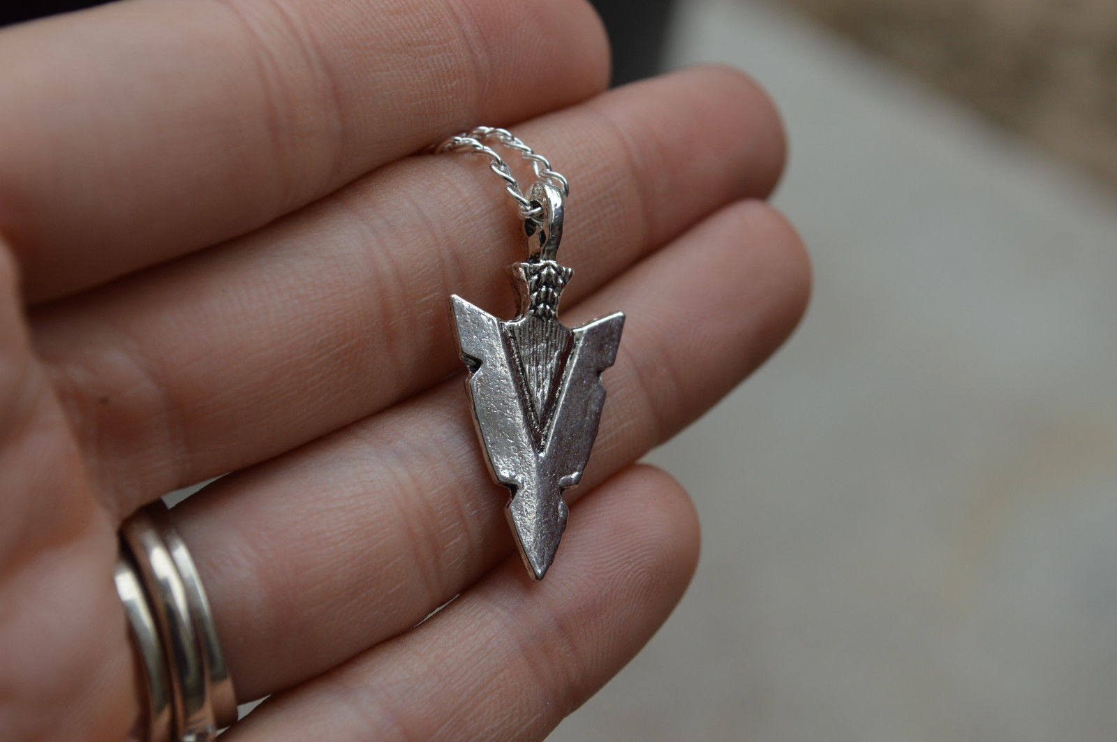 Title 2, Arrow pendant