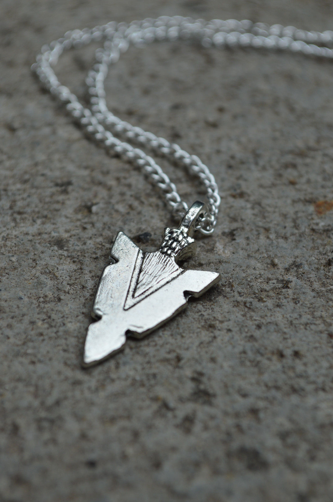 Title 3, Arrow pendant