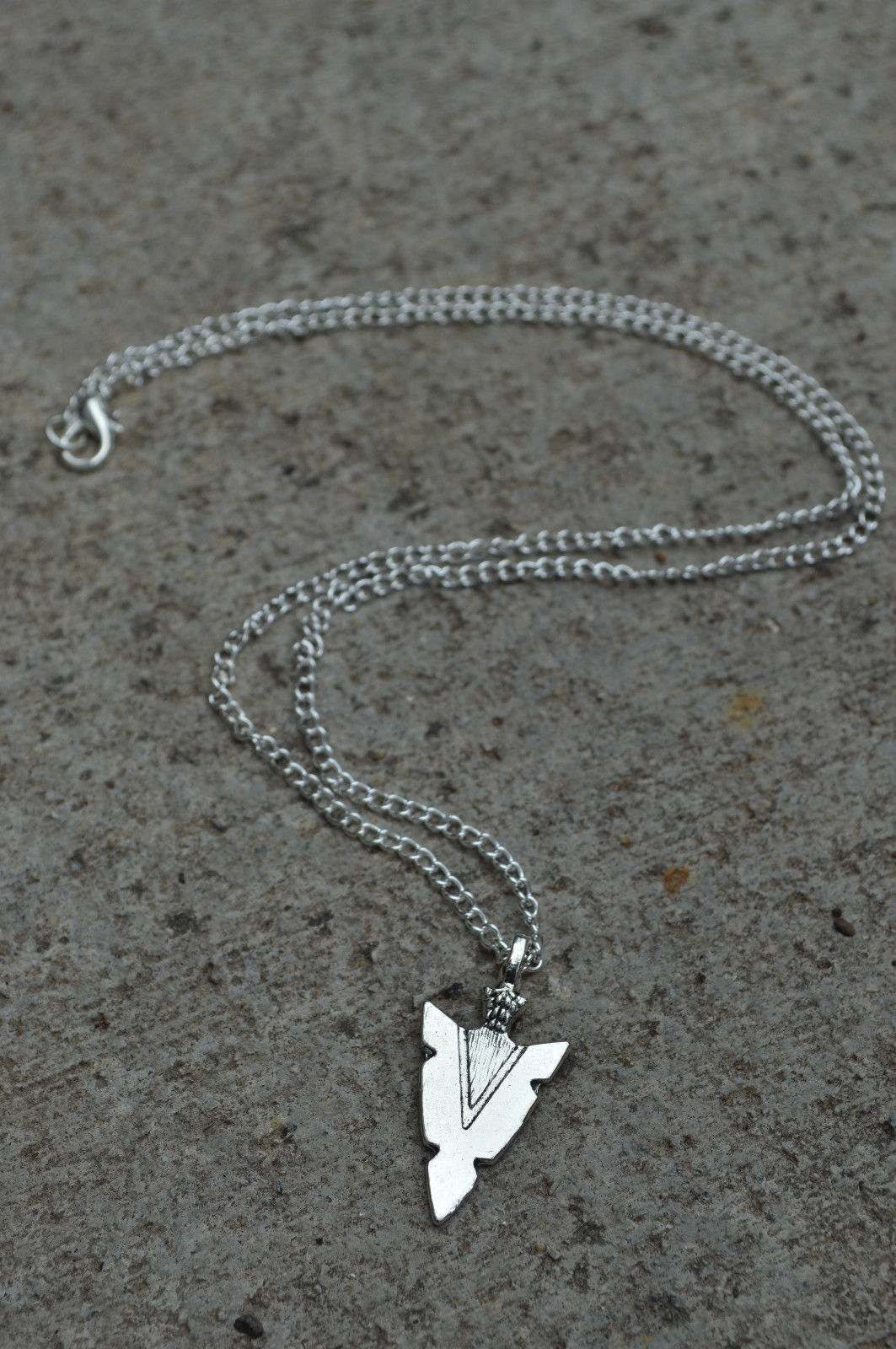 Title 4, Arrow pendant