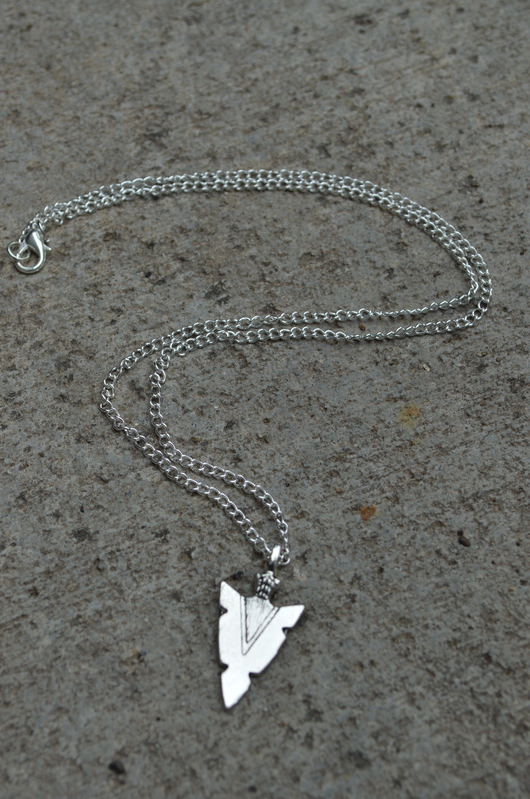 Title 6, Arrow pendant