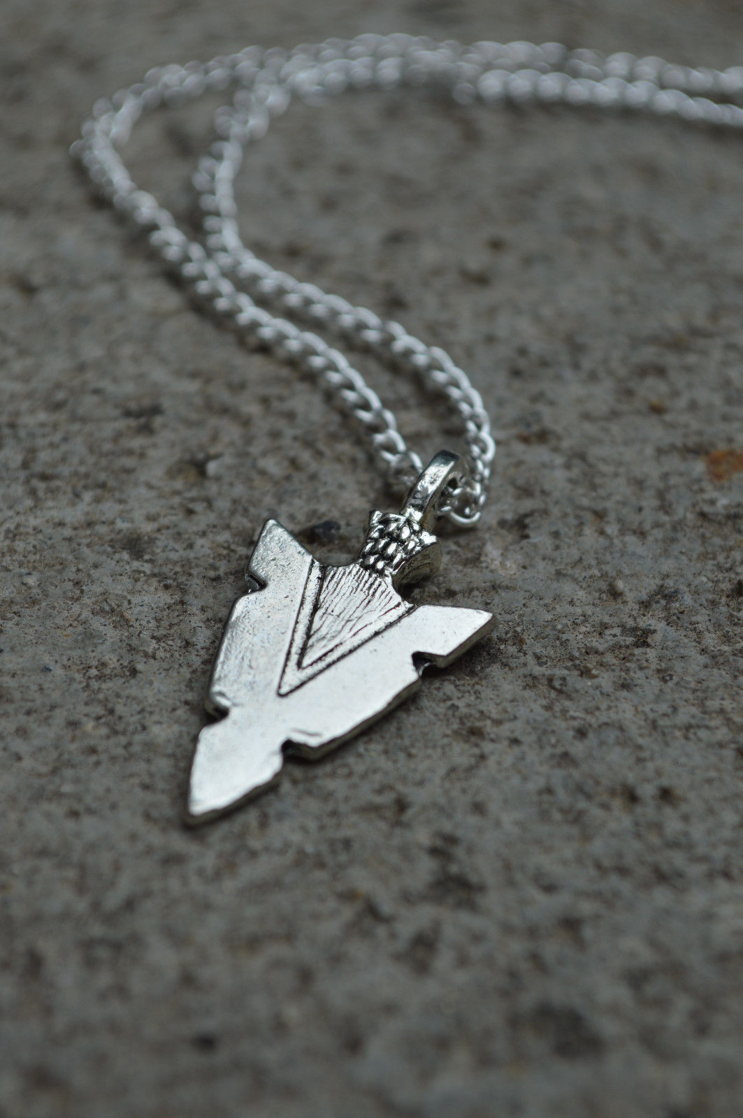 Title 7, Arrow pendant