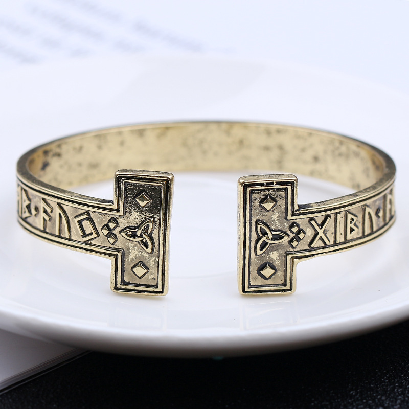 Title 9, Ancient gold text bracelet