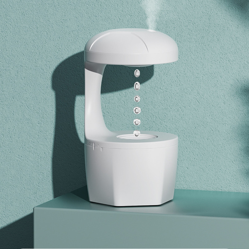 Anti-gravity white humidifier with silent operation, ideal for small rooms.