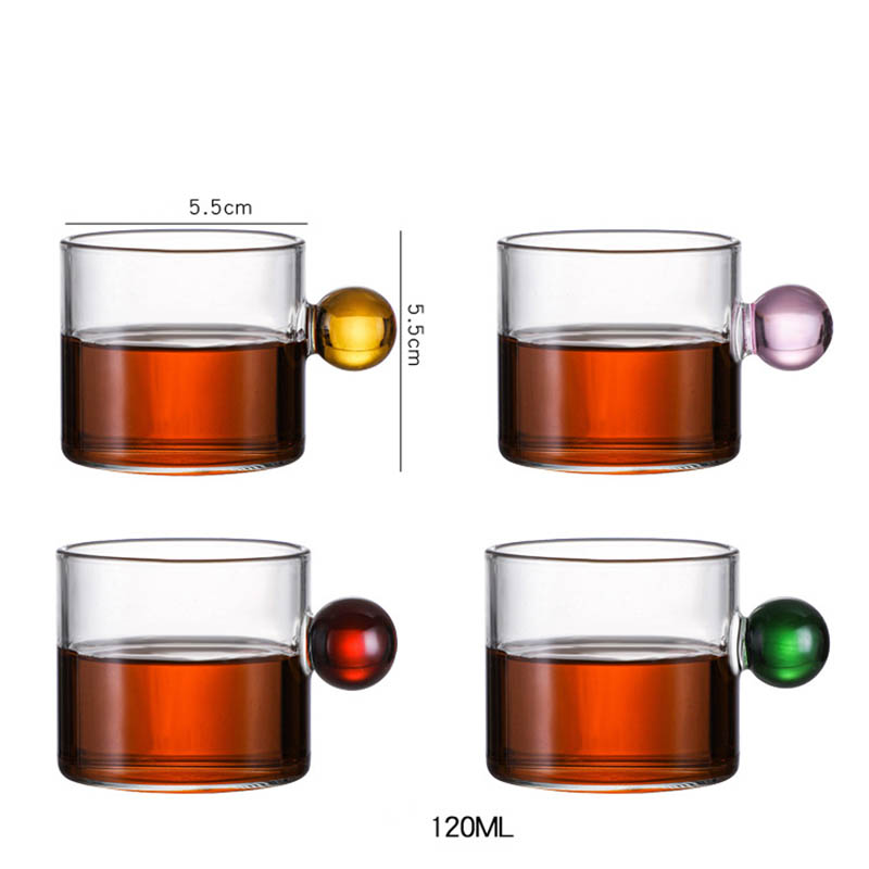 Coffee cup with glass sphere handle in Nordic style.