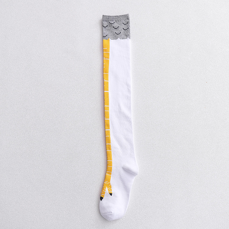 Single novelty knee-high sock in white with a yellow bird leg design running down the front and gray feather-like pattern at the top.