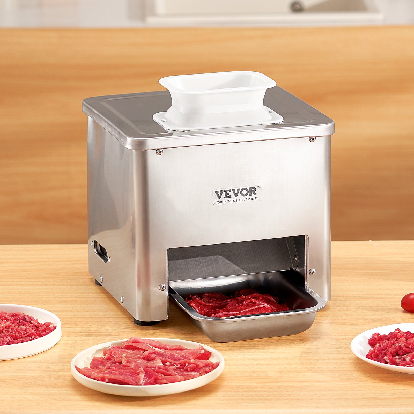 Commercial meat cutter slicing boneless meat