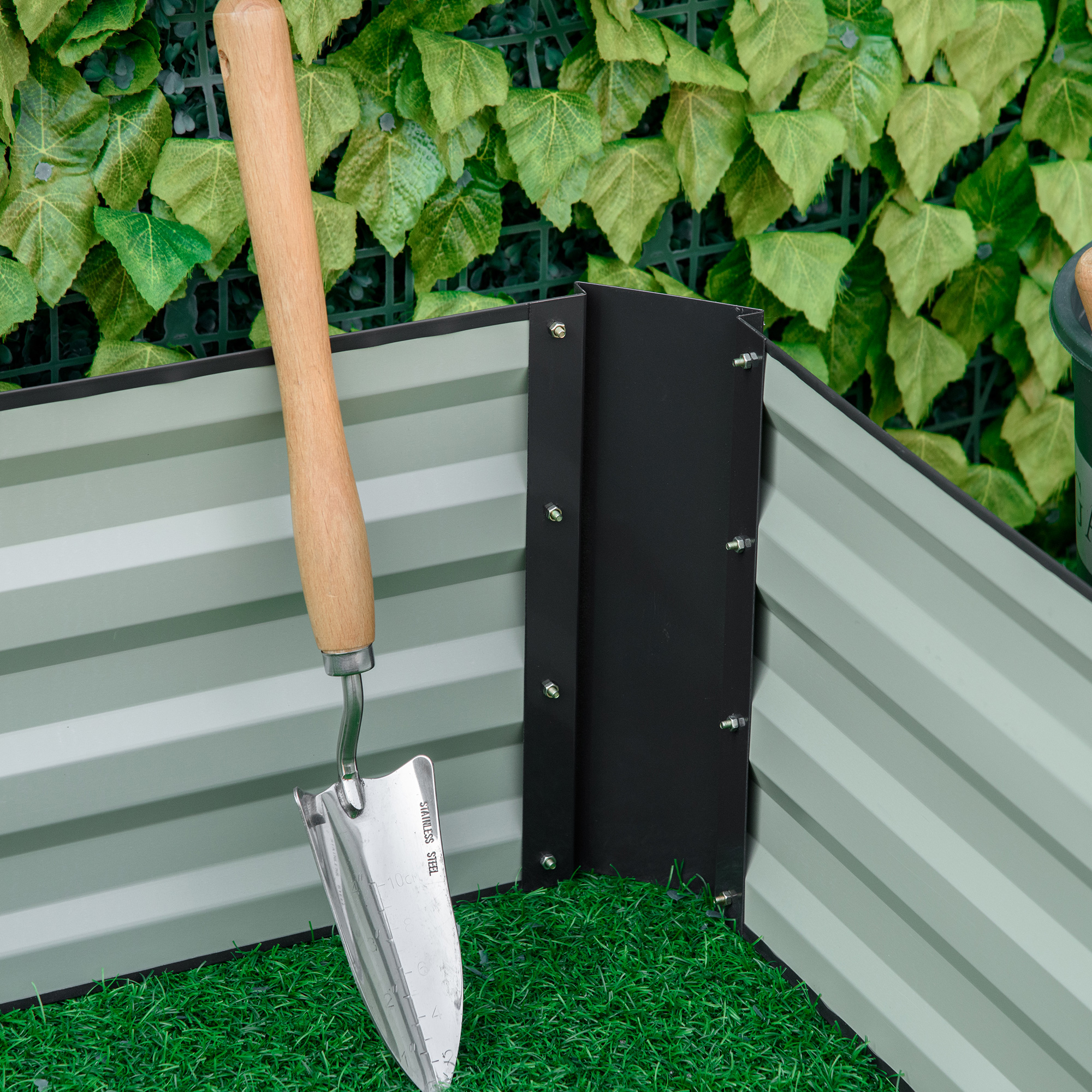Close-up of galvanized steel panels and open-bottom design of the raised garden bed
