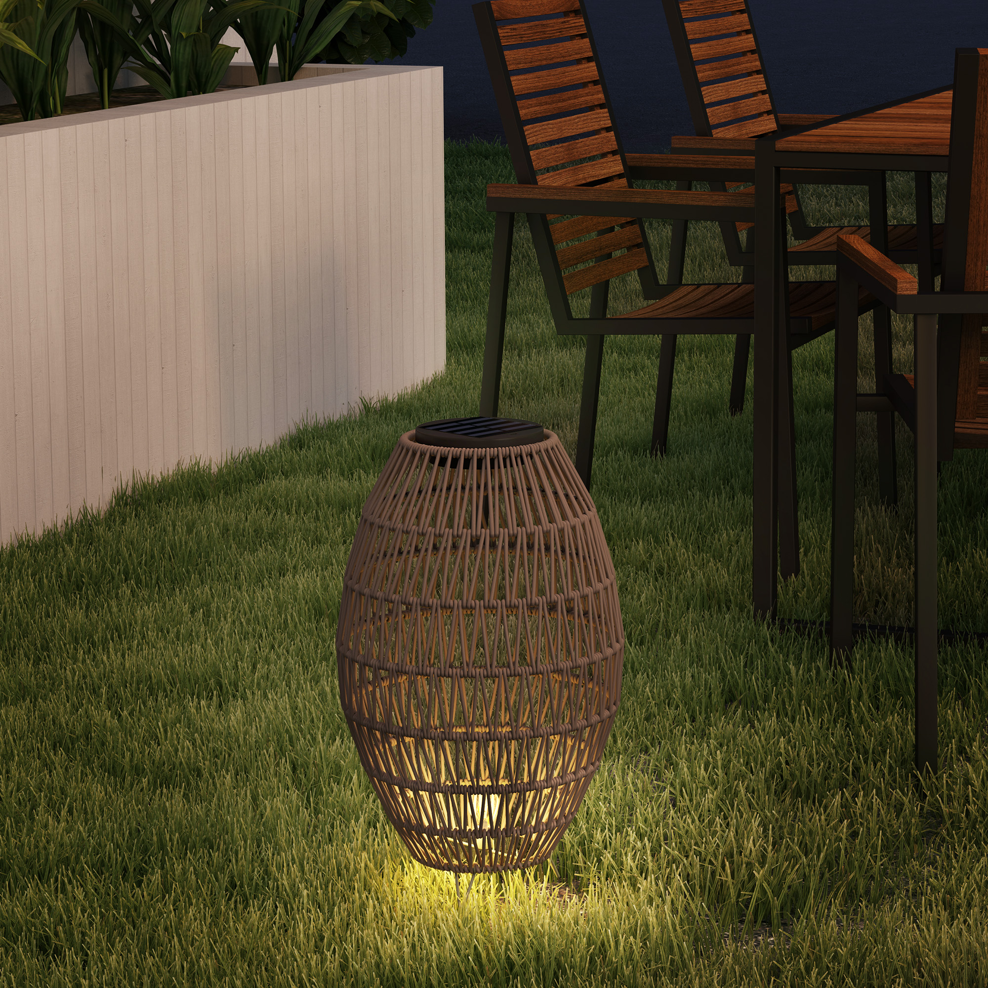 Rattan solar lamp positioned on garden path surrounded by plants